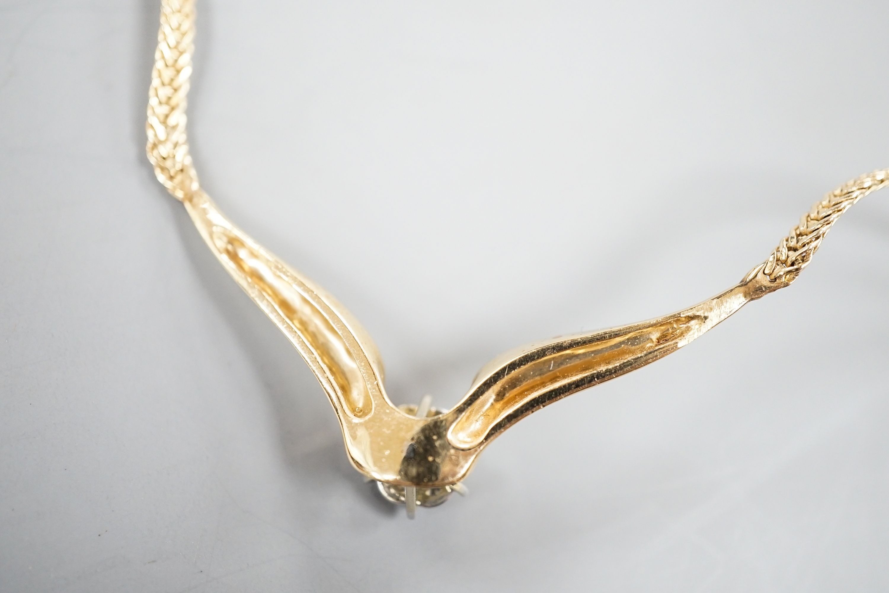 A modern 14k yellow metal and seven stone diamond cluster set necklace, 38cm, gross weight 12.3 grams.